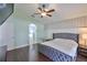 Spacious main bedroom featuring an ensuite bathroom, ceiling fan, and natural light at 7657 Nottinghill Sky Dr, Apollo Beach, FL 33572