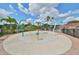 A colorful splash pad area with various water features, surrounded by palm trees and landscaping for Gathering fun at 7657 Nottinghill Sky Dr, Apollo Beach, FL 33572