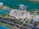 Aerial view of complex featuring tennis courts, boat slips, and convenient parking at 7665 Sun Island S Dr # 307, South Pasadena, FL 33707