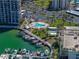 Aerial view showcasing the marina, pool, and well-maintained grounds for residents and guests at 7665 Sun Island S Dr # 307, South Pasadena, FL 33707