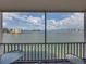Balcony view showcasing seating and serene waterfront views at 7665 Sun Island S Dr # 307, South Pasadena, FL 33707
