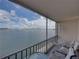 Screened balcony with seating and waterfront view at 7665 Sun Island S Dr # 307, South Pasadena, FL 33707