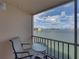 Balcony view showcasing seating and serene waterfront views at 7665 Sun Island S Dr # 307, South Pasadena, FL 33707