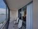 Balcony with seating and water views leading into the home at 7665 Sun Island S Dr # 307, South Pasadena, FL 33707