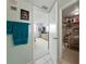 View from the bathroom to the bedroom showing the bed, dresser, TV and open closet at 7665 Sun Island S Dr # 307, South Pasadena, FL 33707