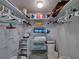 Walk in closet with shelving, hanging rods, storage containers and ample space at 7665 Sun Island S Dr # 307, South Pasadena, FL 33707