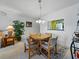 Inviting dining area with wood furnishings, seamlessly connected to the living room and the kitchen at 7665 Sun Island S Dr # 307, South Pasadena, FL 33707