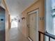 Hallway leading to unit 307, with elevator access, on an upper floor at 7665 Sun Island S Dr # 307, South Pasadena, FL 33707