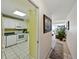 Open concept kitchen leading to living area with a view at 7665 Sun Island S Dr # 307, South Pasadena, FL 33707