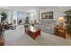 Bright living room with comfortable seating and balcony access showcasing water views at 7665 Sun Island S Dr # 307, South Pasadena, FL 33707