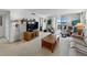 Spacious living room features a waterfront view, comfortable seating, and a stylish wooden coffee table at 7665 Sun Island S Dr # 307, South Pasadena, FL 33707