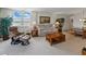 Inviting living area featuring neutral tones, plush seating, and serene water views at 7665 Sun Island S Dr # 307, South Pasadena, FL 33707
