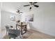 Bright home office features a ceiling fan, a decorative rug and natural light at 7991 1St S Ave, St Petersburg, FL 33707