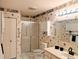 Bathroom with sink, vanity, and shower at 810 Bluewater Dr, Sun City Center, FL 33573