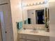 Well lit bathroom featuring vanity with mirror and towels at 810 Bluewater Dr, Sun City Center, FL 33573