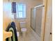 Bathroom featuring patterned wallpaper, toilet and shower at 810 Bluewater Dr, Sun City Center, FL 33573