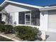 Inviting screened front porch, offering a cozy seating area and protection from the elements at 810 Bluewater Dr, Sun City Center, FL 33573