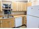 Well-lit kitchen featuring bright cabinetry, modern appliances and a practical layout at 810 Bluewater Dr, Sun City Center, FL 33573
