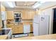 Classic kitchen with laminate countertops, white appliances, ample cabinets, and a bright, airy feel at 810 Bluewater Dr, Sun City Center, FL 33573