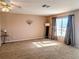 Spacious living room featuring a neutral color palette, carpet flooring and lots of natural light at 810 Bluewater Dr, Sun City Center, FL 33573