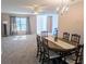 Open living and dining area filled with light and neutral tones, perfect for relaxation and entertaining at 810 Bluewater Dr, Sun City Center, FL 33573
