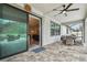 Spacious covered patio offers seamless indoor-outdoor living, featuring a dining area and view of the pool at 8320 Bluevine Sky Dr, Land O Lakes, FL 34637