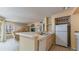 Bright kitchen area offering updated appliances, breakfast bar and an open concept design at 8517 Island Breeze Ln # 106, Temple Terrace, FL 33637