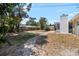 Backyard with stepping stone path, shed, and plenty of space for outdoor activities at 8696 118Th St, Seminole, FL 33772