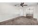 Bright bedroom with ceiling fan, plush carpet, and closet with mirrored sliding doors at 8696 118Th St, Seminole, FL 33772