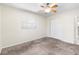 Bedroom featuring a ceiling fan, plush carpet, closet, and window for natural light at 8696 118Th St, Seminole, FL 33772