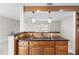 Open-concept kitchen with a breakfast bar that flows into the living area at 8696 118Th St, Seminole, FL 33772