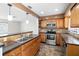 Spacious kitchen features wood cabinets, stainless steel appliances, and a breakfast bar at 8696 118Th St, Seminole, FL 33772