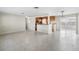 Large living area with terrazzo floors offering easy access to kitchen and other rooms at 8696 118Th St, Seminole, FL 33772