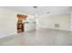 Bright and open living area with terrazzo flooring and seamless access to the kitchen at 8696 118Th St, Seminole, FL 33772
