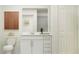 Clean, bright bathroom features white cabinetry, sleek hardware, and modern fixtures, offering a refreshing design at 10290 Purple Leaf Ct, Riverview, FL 33578