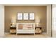 Comfortable Bedroom with stylish décor, a crib, and elegant bedside tables at 10290 Purple Leaf Ct, Riverview, FL 33578