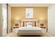 Stylish bedroom with a bed, matching nightstands, and a neutral color scheme at 10290 Purple Leaf Ct, Riverview, FL 33578