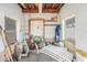 Messy garage with various gardening tools, a peg board, and outdoor furniture at 109 S Nimbus Ave, Clearwater, FL 33765