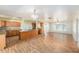 Open kitchen with wooden cabinetry, granite countertops, and stainless steel appliances at 109 S Nimbus Ave, Clearwater, FL 33765