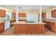 Kitchen with granite countertops, a center island, and stainless steel appliances at 109 S Nimbus Ave, Clearwater, FL 33765