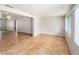 Open-concept living room with ceramic tile flooring and ample natural light, creating a welcoming and comfortable atmosphere at 109 S Nimbus Ave, Clearwater, FL 33765