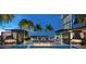 Luxury pool with fire pit, cabanas, and lounge seating, offering a resort-style experience with stunning views at 1101 E Jackson St, Tampa, FL 33602