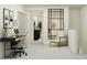 Modern office area featuring a sleek desk and a comfortable chair at 11115 E 65Th Ter, Palmetto, FL 34221