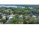 An aerial view of neighborhood, homes with tree coverage and a nearby body of water at 11709 N Armenia Ave, Tampa, FL 33612