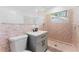 Bathroom with shower, single vanity, tiled walls, and modern fixtures, offering a cozy and functional space at 11709 N Armenia Ave, Tampa, FL 33612