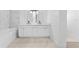 Bathroom featuring a double sink vanity with ample storage and modern fixtures at 11709 N Armenia Ave, Tampa, FL 33612
