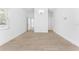 Bright bedroom with modern floors, white walls, and natural light from the window at 11709 N Armenia Ave, Tampa, FL 33612