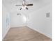 Bedroom with modern flooring, ceiling fan and natural light from the window at 11709 N Armenia Ave, Tampa, FL 33612