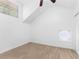 Bright bedroom with a window, unique round window, and closet, offering comfortable living space at 11709 N Armenia Ave, Tampa, FL 33612