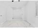 Bedroom with marble tile floors, a window, and multiple doors at 11709 N Armenia Ave, Tampa, FL 33612